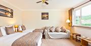 Family Room with a Double Bed and a Twin Bed at The Glen Guest House in Oxenholme, Cumbria