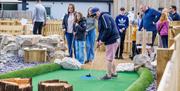 Family Playing at Foxy's Adventure Golf in Penrith, Cumbria