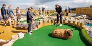 Family Playing at Foxy's Adventure Golf in Penrith, Cumbria