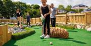 Family Playing at Foxy's Adventure Golf in Penrith, Cumbria