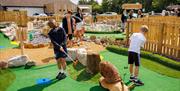 Family Playing at Foxy's Adventure Golf in Penrith, Cumbria