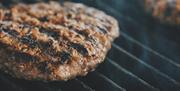 Meat on the grill at Tebay Services Farmshop and Kitchen in Tebay, Cumbria
