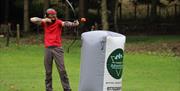 Visitor Playing Archery Tag with Genuine Adventures in the Lake District, Cumbria