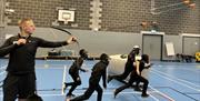 Visitors Playing Archery Tag with Genuine Adventures in the Lake District, Cumbria