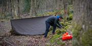 Visitor Building a Shelter on the Intensive 72 hour Survival Experience with Green Man Survival