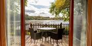 Balcony Seating and Lake Views at Gadwall Lodge at The Tranquil Otter in Thurstonfield, Cumbria