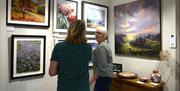 Visitors viewing Art on Display at Gallery North West in Brampton, Cumbria