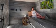 Visitor in a Sauna at the Spa Space at Gilpin Hotel near Windermere, Lake District