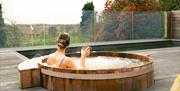 Visitor in a Hot Tub at the Spa Space at Gilpin Hotel near Windermere, Lake District