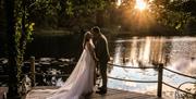 Bridal Couple Posing at Sunset at a Wedding at The Gilpin Hotel & Lake House in Windermere, Lake District