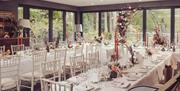 Wedding Breakfast Seating at a Wedding at The Gilpin Hotel & Lake House in Windermere, Lake District