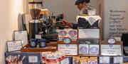 Staff Making Coffee behind the Counter at Grasmere Gingerbread® in Hawkshead, Lake District