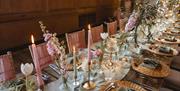 Table decorated for a wedding breakfast at Abbey House Hotel & Gardens in Barrow-in-Furness, Cumbria