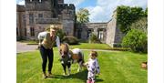 Child with Shetland Pony at Greystoke Castle in Greystoke, Cumbria