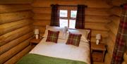 Double bed in The Cabin at Grizedale Forest in the Lake District, Cumbria