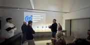Visitors in the Meteorite Room at Grizedale Observatory in the Lake District, Cumbria