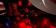 Visitors watching a display at Grizedale Observatory in the Lake District, Cumbria