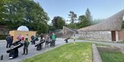 Visitors using telescopes outside Grizedale Observatory in the Lake District, Cumbria