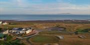 Hole 18 green and Clubhouse at Maryport Golf Club in Maryport, Cumbria