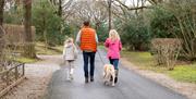 Family and dog on a walk at Holgates Holiday Park in Silverdale, Cumbria