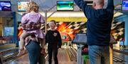 Family bowling at Holgates Holiday Park in Silverdale, Cumbria
