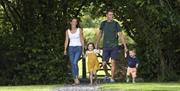 Family Walking at Hollins Farm Holiday Park in Far Arnside, Cumbria