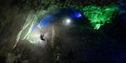 Visitor Climbing in the Mine at Honister Slate Mine in Borrowdale, Lake District