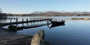 Boat docked at a jetty on a fishing trip with West Pennine Angling Solutions in the Lake District, Cumbria