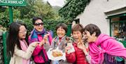 Visitors to the Grasmere Gingerbread Shop in Grasmere, Lake District