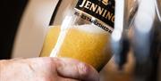 Beer being poured at Jennings Brewery in Cockermouth, Cumbria