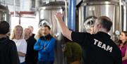 Team member giving a brewery tour at Jennings Brewery in Cockermouth, Cumbria