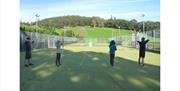 Visitors Participating in Archery with Joint Adventures in the Lake District, Cumbria