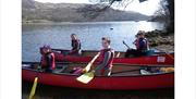 Visitors on the Wild Cat Island Swallows and Amazons Tour with Joint Adventures in the Lake District, Cumbria