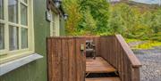 Porch and entrance to Juniper Lodge at Coniston Shepherd Hut Lodges in Coniston, Lake District