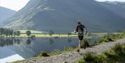 Visitor trail running at Keswick Mountain Festival in the Lake District, Cumbria