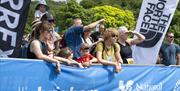 Visitors watching a race at Keswick Mountain Festival in the Lake District, Cumbria