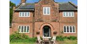 Exterior and Outdoor Seating at Keepers Cottage in Ivegill, Cumbria