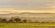 Scenic views of distant mountains at Keepers Cottage in Ivegill, Cumbria