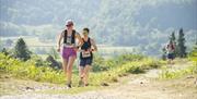 Sporting event participants running during an event at Keswick Mountain Festival in Keswick, Lake District