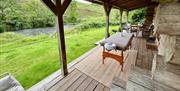 Massage table set up on the porch of a venue by Lake District Pamper Company
