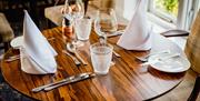 Table Settings in the Dining Room at Lindeth Howe in Bowness-on-Windermere, Lake District