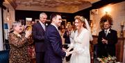 A Couple Celebrating Their Wedding at Lindeth Howe in Bowness-on-Windermere, Lake District