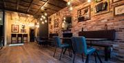 Dining Room Seating and Rustic Decor at Lake View Garden Bar in Bowness-on-Windermere, Lake District