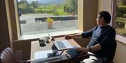 Guest admiring the views from Lake District Castle Inn in Bassenthwaite, Lake District