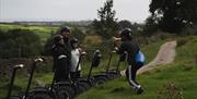 Visitors enjoying an experience with Lakeland Segway in Cartmel, Lake District