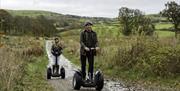 Visitors enjoying an experience with Lakeland Segway in Cartmel, Lake District