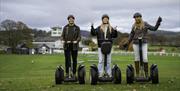 Visitors enjoying an experience with Lakeland Segway in Cartmel, Lake District