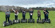 Visitors enjoying an experience with Lakeland Segway in Cartmel, Lake District