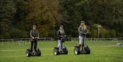 Visitors enjoying an experience with Lakeland Segway in Cartmel, Lake District