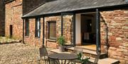 Exterior seating at The Barn at Linden Farm House in Langwathby, Cumbria